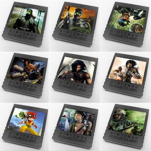 May include: Nine black Nintendo GameCube game cases with different game covers. The covers feature characters from various video games, including a masked figure in a green suit, a man with a sword, and a woman with a gun.