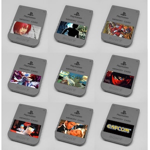 May include: Nine gray PlayStation memory cards with different colorful images. Each card has the text "PlayStation Memory Card" and the Sony logo. The images include anime characters, video game scenes, and the Capcom logo.