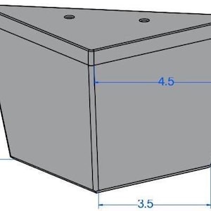 May include: A gray, triangular furniture leg with a flat top and angled sides. The leg is 5 inches high, 4.5 inches wide at the top, and 3.5 inches wide at the bottom. Two small holes are visible on the top surface.