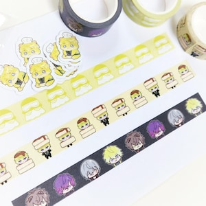 May include: A collection of decorative washi tapes and stickers. The tapes feature repeating patterns of cartoon characters and shapes in yellow, black, and brown. Stickers of a cartoon character are also included.