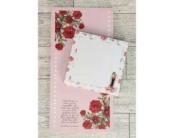 May include: A pink notepad with a white lined page and a floral design. The notepad has a quote from St. Therese of Lisieux: "Love knows no such word as impossible. Our Lord does and asks as much of our greatness as of our littleness, or as much of the difficulty as of the time, so that we do them."