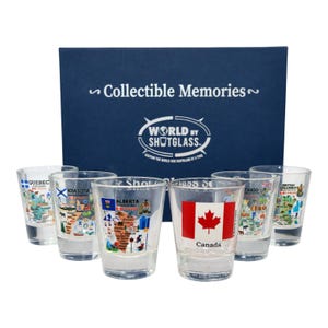 May include: A set of clear shot glasses with colorful designs representing Canadian provinces and territories. The set includes a box with the text "Collectible Memories" and "World by Shotglass". Each glass features a different province or territory.