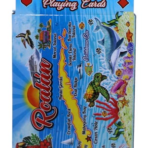 May include: A deck of playing cards with a colorful illustration of Roatan Island, Honduras. The illustration features a map of the island with various landmarks, including Morat Island, Punta Gorda, Crawfish Rock, Oak Ridge, Sandy Bay, Anthony's Key, Mahogany Bay, West End, Coxen Hole, and West Bay Beach. The illustration also features a variety of marine life, including a dolphin, a sea turtle, a jellyfish, and a parrot.