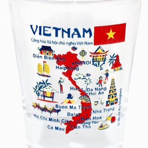 May include: A clear glass shot glass with a colorful map of Vietnam printed on the side. The map includes the country's major cities and landmarks, along with the text "VIETNAM" and "Cộng h&ograve;a X&atilde; hội chủ nghĩa Việt Nam".