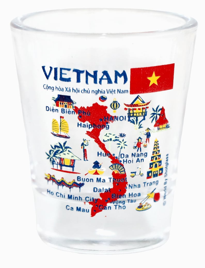 May include: A clear glass shot glass with a colorful map of Vietnam printed on the side. The map includes the country's major cities and landmarks, along with the text "VIETNAM" and "Cộng h&ograve;a X&atilde; hội chủ nghĩa Việt Nam".