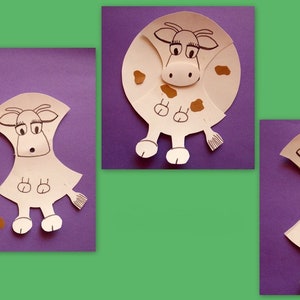 Puede incluir: Un proyecto de manualidades de papel para hacer una vaca. La imagen muestra los pasos involucrados en la realización de la manualidad. El primer paso muestra las piezas de papel necesarias para hacer la vaca. El segundo paso muestra la vaca ensamblada. El tercer paso muestra la vaca con manchas marrones.