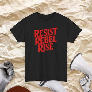 Resist Rebel Rise – Political Statement T-Shirt | Anti-Government Protest Shirt | Rebellion Against the System | Unisex Cotton
