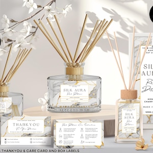 May include: A set of reed diffuser bottle templates with a marble design and gold accents. The bottles are labeled "Silk Aura Reed Diffuser" and include a thank you card and care instructions. The bottles are 120ml / 4 oz.