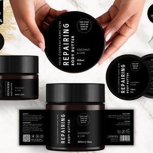 May include: Three black jars of body butter with white labels. The labels say "Your Company Name Here", "Repairing Body Butter", "Coconut & Lime", and "120ml | 4oz" or "360ml | 12oz".