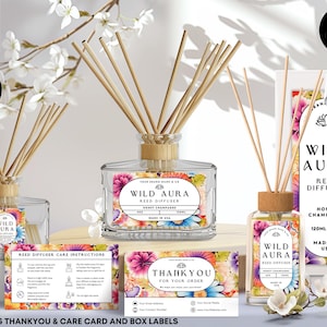 May include: A collection of Wild Aura reed diffusers with floral labels, wooden reeds, and a Honey Champagne scent. The set includes a thank you card, care instructions, and box labels. The bottles are 4 oz (120ml) each.