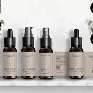 May include: Four brown glass bottles with black caps and labels, labeled "Oil Serum", "Face Serum", "Body Mist", and "Hair Serum". The labels include the text "Oatmeal & Honey". The image also includes a label with product information and icons.