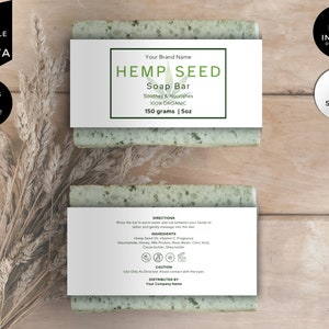 Puede incluir: Dos barras rectangulares de jabón de semillas de cáñamo con etiquetas blancas. Las etiquetas dicen "HEMP SEED Soap Bar" y "100% ORGANIC, 150 gramos | 5oz". La imagen también incluye texto que dice "EDITABLE IN CANVA", "BONUS ITEMS INSIDE!", "INSTANT DOWNLOAD" y "3 SIZES".