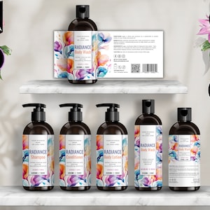 May include: Six brown bottles with pumps, each labelled with a colourful floral design and the text "RADIANCE" followed by the product name: "Body Wash", "Shampoo", "Conditioner", "Body Lotion", and "Body Wash". The bottles are arranged on a white shelf with a white background.