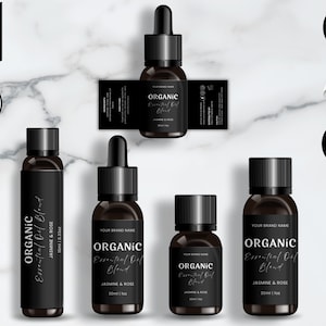 May include: Four black glass bottles with droppers, labeled "ORGANIC Essential Oil Blend" with the scent "Jasmine & Rose". The bottles are on a white marble background. The labels are editable in Canva.
