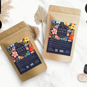 May include: Two brown paper bags with labels featuring a floral design and the text "EDEN AURA BATH SALTS". The labels are blue with white text and a QR code.