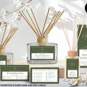 May include: A collection of reed diffusers with wooden reeds, displayed with thank you and care cards, and box labels. The diffusers are in clear glass bottles with green labels. The text includes "Reed Diffuser" and "Jasmine & Vanilla".