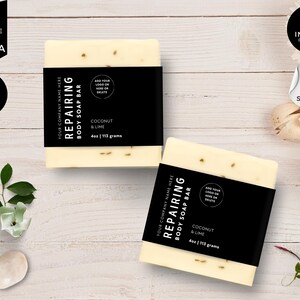May include: Two white soap bars with black labels that say "Repairing Body Soap Bar" with the text "Coconut & Lime" and "4oz | 113 grams". The labels are customizable with a logo and text.