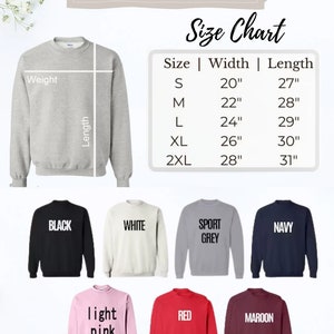 May include: A size chart for sweatshirts with measurements in inches. The chart shows the width and length of sweatshirts in sizes S, M, L, XL, and 2XL. The image also shows different color options for the sweatshirts, including black, white, sport grey, navy, light pink, red, and maroon.