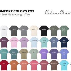 May include: Color chart showing 24 different colors of unisex heavyweight t-shirts. The colors include white, pepper, grey, ivory, black, moss, light green, berry, blossom, orchid, chambray, chalky mint, blue jean, true navy, seafoam, blue spruce, khaki, bay, violet, grape, flo blue, red, yam, terracotta, watermelon, crimson, espresso, and lagoon blue.
