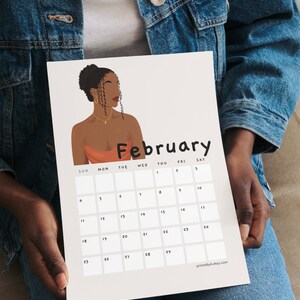 May include: A printable calendar featuring a digital illustration of a woman with dark skin and curly hair. The calendar is for February and has the days of the week labeled at the top. The background is a light beige color.