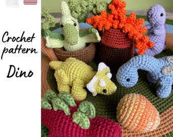 May include: A collection of colorful, crocheted dinosaur figures, including a green and yellow triceratops, a blue brontosaurus, and a red stegosaurus. The image also includes a crocheted pterodactyl and a crocheted tree. The text "Crochet pattern Dino" is visible.