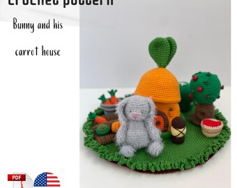 May include: A crochet pattern for a bunny and his carrot house. The scene features a gray bunny, an orange carrot-shaped house, and a green grassy base. Additional elements include a tree, carrots, and a small basket.