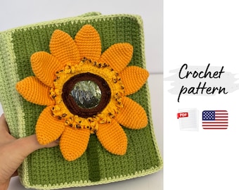 May include: A green crocheted square with a large orange and yellow sunflower applique. The sunflower has a brown center. The text "Crochet pattern" is visible in the image.