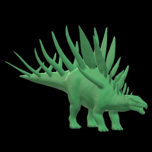 May include: A green 3D model of a dinosaur with a row of spines running down its back.