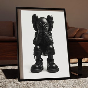 Puede incluir: Impresi&oacute;n enmarcada en blanco y negro de una escultura negra de un personaje de dibujos animados con las manos cubri&eacute;ndose la cara. El personaje lleva una chaqueta y pantalones negros y botas negras.