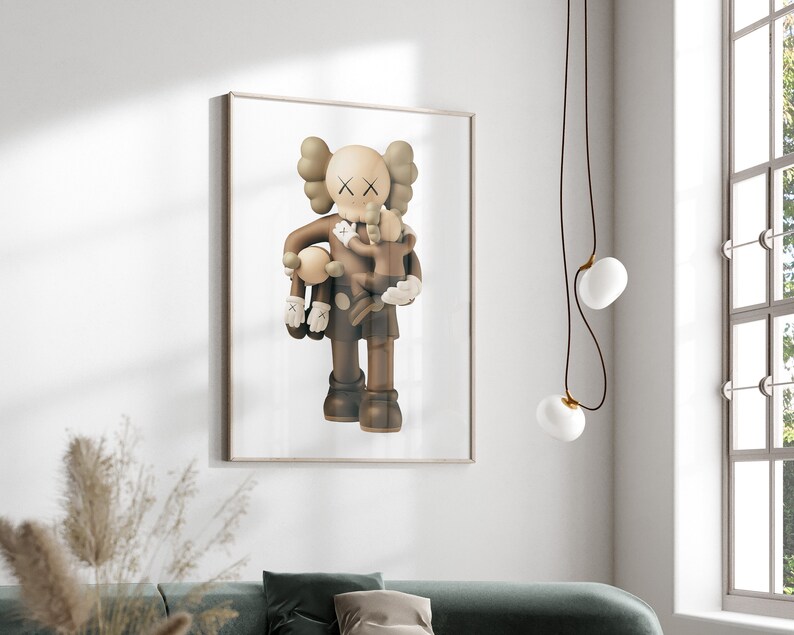 May include: A brown and beige illustration of a cartoon character holding two smaller cartoon characters. The larger character has a large head with X-shaped eyes and a small mouth. The smaller characters are also brown and beige and have similar features.