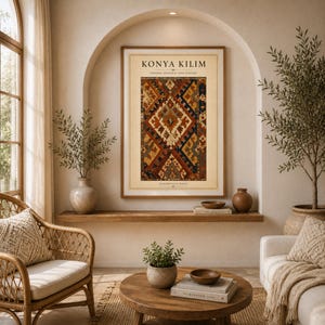 May include: A framed wall art print titled KONYA KILIM, CENTRAL ANATOLIA, 19TH CENTURY, HANDWOVEN WOOL. The print features a vertical rectangular rug design with geometric diamond patterns in shades of deep red, navy blue, and cream on a beige background.