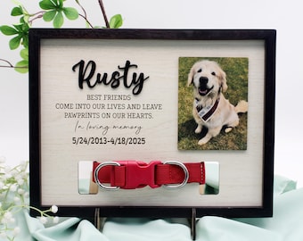 May include: A wooden memorial frame with a black frame and a photo of a golden retriever dog. The frame has a slot for a dog collar and the text "Rusty Best Friends Come into our lives and leave pawprints on our hearts. In loving memory 5/24/2013-4/18/2025"