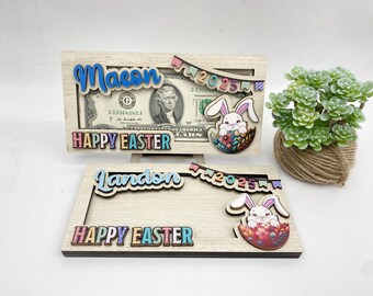 May include: Two wooden picture frames with a bunny rabbit design and the text "Happy Easter" and the year "2025". The top frame has the name "Mason" and the bottom frame has the name "Landen".