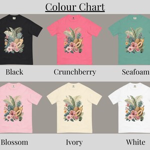 May include: A color chart of six t-shirts in various colors: black, crunchberry, seafoam, blossom, ivory, and white. Each shirt features a tropical floral and fruit design. The text "Colour Chart" is at the top, and color names are below each shirt.