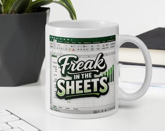 May include: White ceramic mug with the text "Freak in the Sheets" in a green and white design. The mug features a spreadsheet design on the side. A fun and unique gift for anyone who loves spreadsheets.