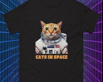 May include: A black t-shirt featuring a graphic of a cat wearing an astronaut suit. The text "CATS IN SPACE" is printed below the image.