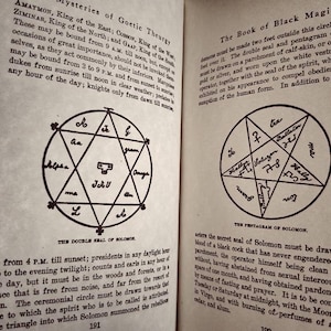 May include: A black and white image of a book page with text about the mysteries of Goetic Theurgy and the Book of Black Magic. The page includes two diagrams: a double seal of Solomon and a pentagram of Solomon.