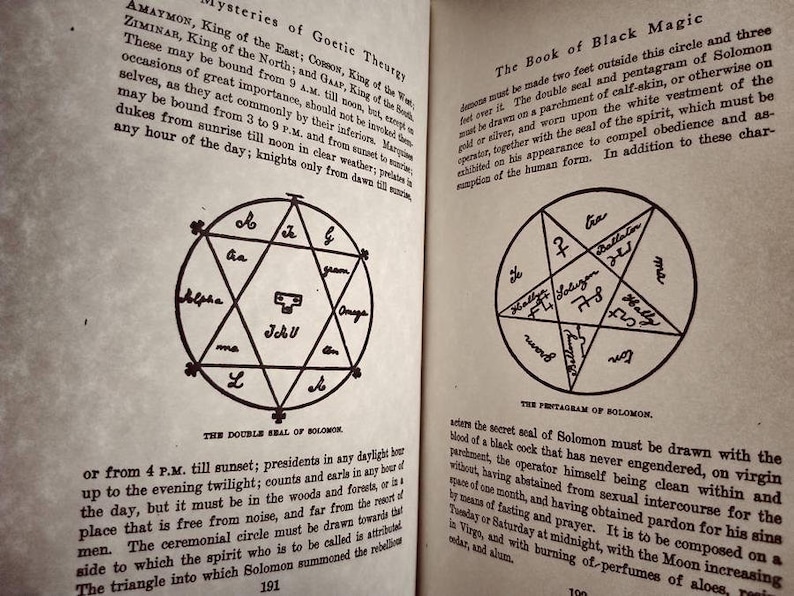 May include: A black and white image of a book page with text about the mysteries of Goetic Theurgy and the Book of Black Magic. The page includes two diagrams: a double seal of Solomon and a pentagram of Solomon.