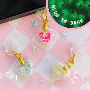 Tapón de polvo de amor que brilla en la oscuridad, amuleto de poción en forma de corazón, tapón antipolvo para el control de juegos de Switch, conector de audio para auriculares.