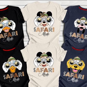May include: Six different t-shirts with a safari theme. Each shirt features a cartoon character wearing a safari hat and holding binoculars. The text "Safari Mode" is printed on each shirt.