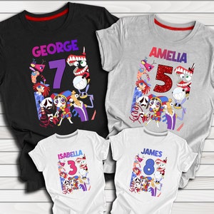 May include: Four white t-shirts with colorful cartoon characters and numbers on them. The shirts are personalized with the names "George", "Amelia", "Isabella", and "James" and the numbers "7", "5", "3", and "8".