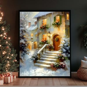 May include: A framed painting depicting a snow-covered cottage with a wooden front door, stone steps, and glowing windows. The scene features snow-laden trees, hanging flower boxes with red and green foliage, and a warm light illuminating the exterior.