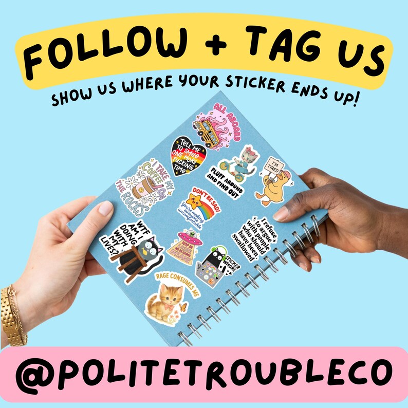 May include: A light blue spiral-bound notebook covered in various colorful stickers featuring cartoon animals, food, and text. The text on the notebook cover reads FOLLOW + TAG US SHOW US WHERE YOUR STICKER ENDS UP! and @POLITETROUBLECO.