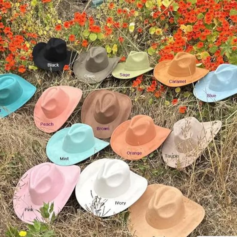 May include: A collection of thirteen cowboy hats in various colours including black, olive, sage, caramel, blue, peach, brown, orange, taupe, mint, pink, ivory, and tan. Each hat features a pinched crown and a wide brim, labelled with its colour name.