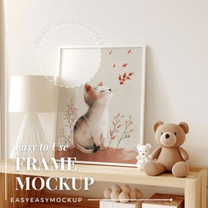 May include: A framed illustration of a cat with red leaves falling around it. The frame is on a wooden shelf with a lamp, a teddy bear, and other decorative items.