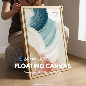 Può includere: Una tela rettangolare con cornice in legno, con pennellate astratte nei toni del blu, bianco e pesca. Il testo "Your Design here", "Smart-Object Layers" e "FLOATING CANVAS" è visibile. La tela ha un bordo avvolto e riflettente.