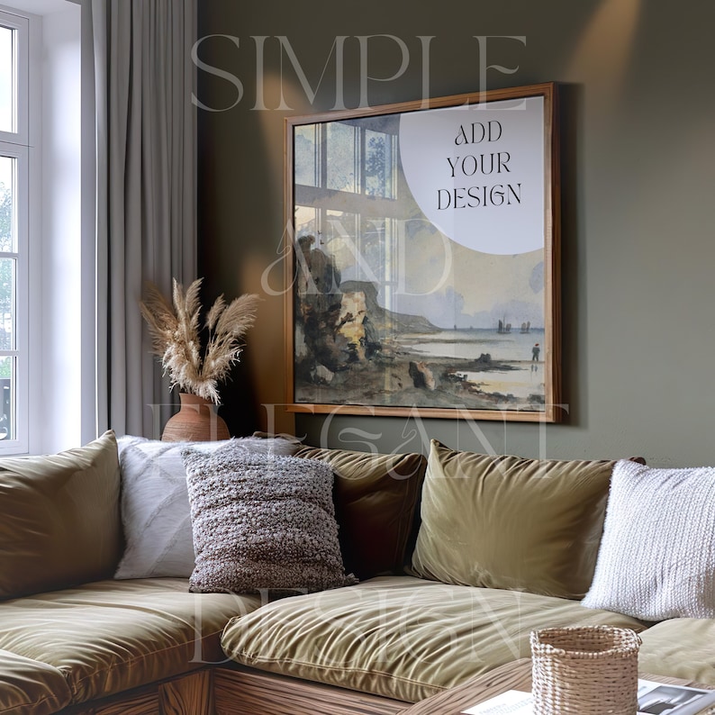 May include: A living room with a green wall, a large framed painting of a seascape, and a brown sectional sofa with white and brown throw pillows. The painting has the text "ADD YOUR DESIGN" on it.