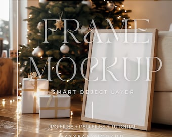 May include: A wooden frame mockup with a white background, sitting on a wooden floor with a Christmas tree and presents in the background. The text "FRAME MOCKUP" is written in white on the image. The text "SMART OBJECT LAYER" is written in white below the frame. The text "JPG FILES + PSD FILES + TUTORIAL" is written in white below the frame. The text "EASYEASYMOCKUP" is written in white below the frame.