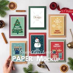 May include: A mockup of Christmas cards with various designs, including a Christmas tree, snowman, and gifts. The cards are in different colored frames, with the text "Merry Christmas" and "HO HO HO". The image also includes decorative elements like pine cones and cinnamon sticks.