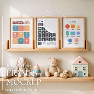 May include: Three wooden picture frames with colorful educational posters for children. The posters include an alphabet chart, a shapes chart, and a chart of daily acts of kindness. The frames are on a shelf with a toy house, a stuffed bear, and a toy car.